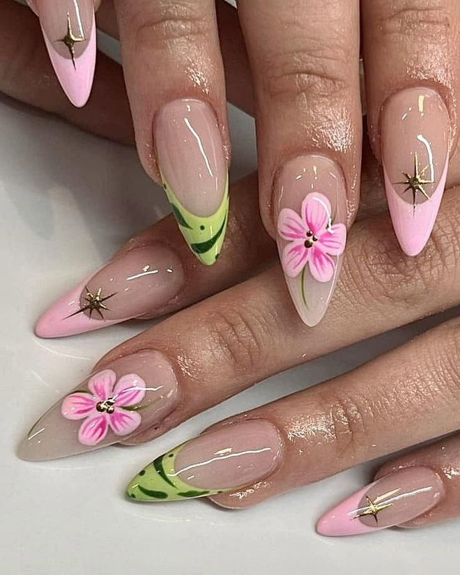 Soft pink nails with hand-painted flowers and gold star details