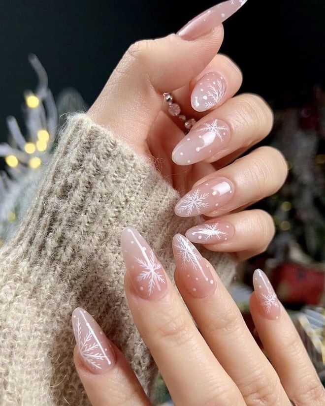 Classic white French tip manicure on almond-shaped nails
